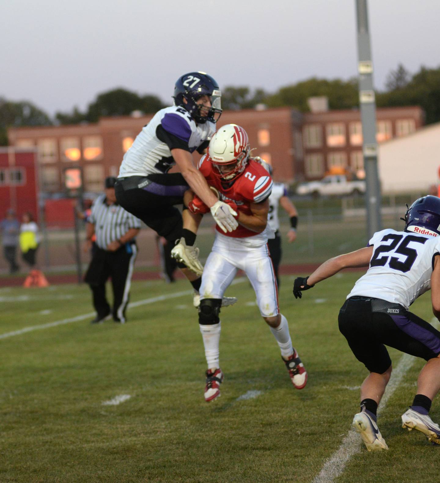 Oregon's Austin Egyed (2) tries to hang on to a pass as Dixon's Eli Davidson (27) tries break up the play on Friday, Sept. 1, 2023 at Oregon High School's Landers-Loomis Field/