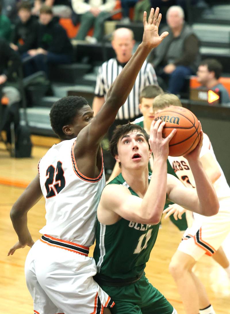 Glenbard West's Logan Brown fights a shot up through DeKalb's Davon Grant during their game Tuesday, Nov. 29, 2022, at DeKalb High School.