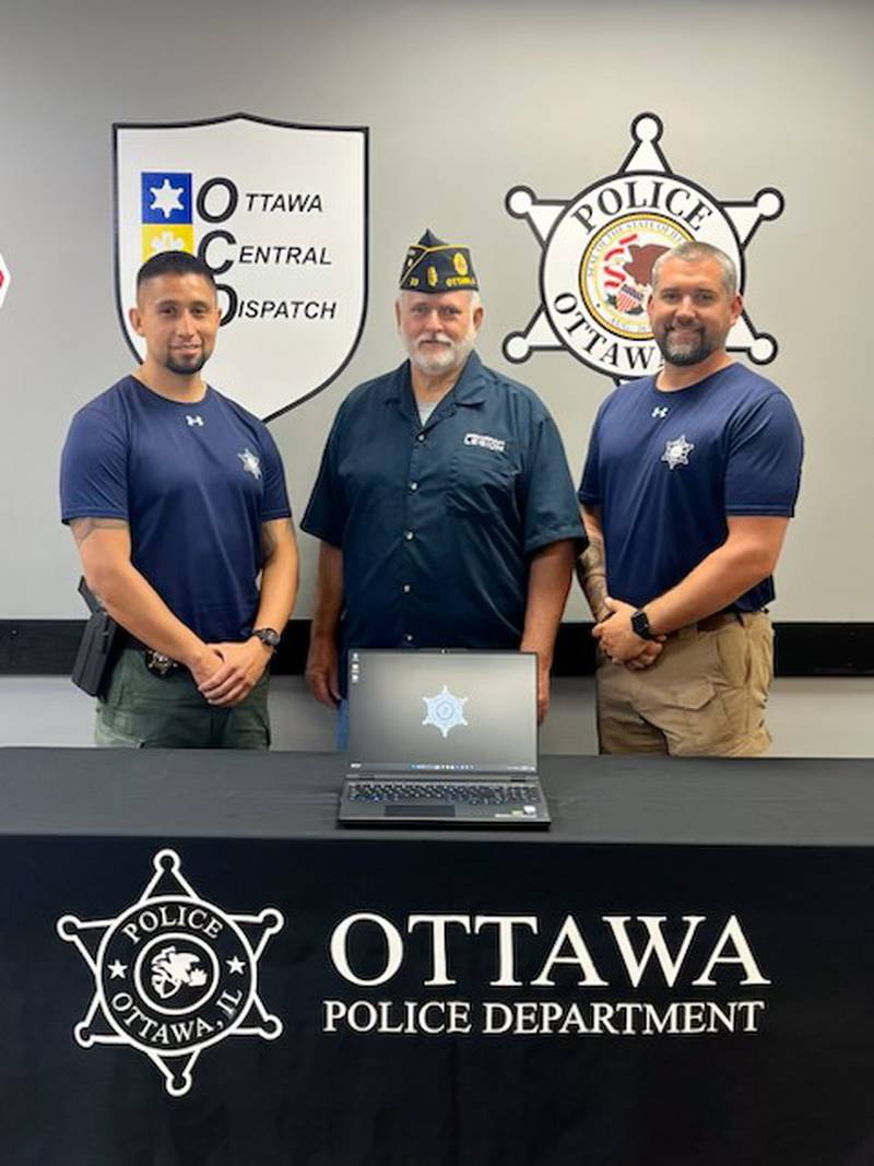 (From left) Ottawa Police Det. Osvaldo "Ozzy" Landeros-Leon, American Legion Post 33 Commander Tom Shea and Det. Sgt. Scott Harden take a photo after the American Legion donated a computer to the Ottawa Police Department to help with digital forensic investigations.