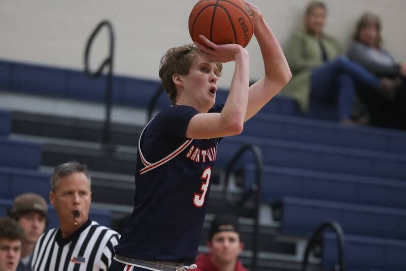 St. Viator’s Mitch Humphrey puts up the three point shot against Joliet Catholic.