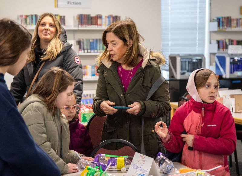 Attendees look at the crafts made by students In the maker space at Saint Mary of Gostyn School's Open House in Downers Grove on Sunday, Jan. 29, 2023.
