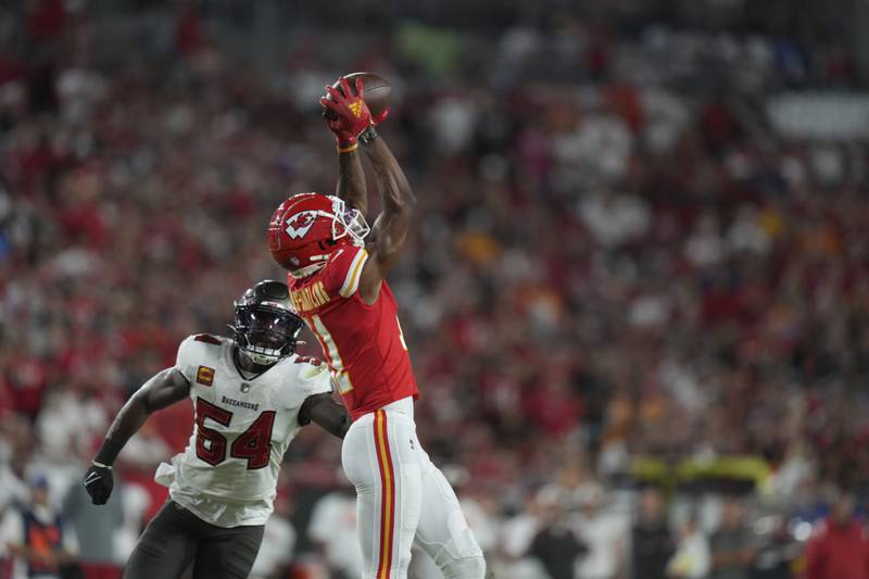 Kansas City Chiefs wide receiver Marquez Valdes-Scantling (11) makes a catch over Tampa Bay Buccaneers linebacker Lavonte David (54) during an NFL football game, Sunday, October 2, 2022 in Tampa, FL. The Chiefs defeat the Buccaneers 41-31. (Peter Joneleit via AP)