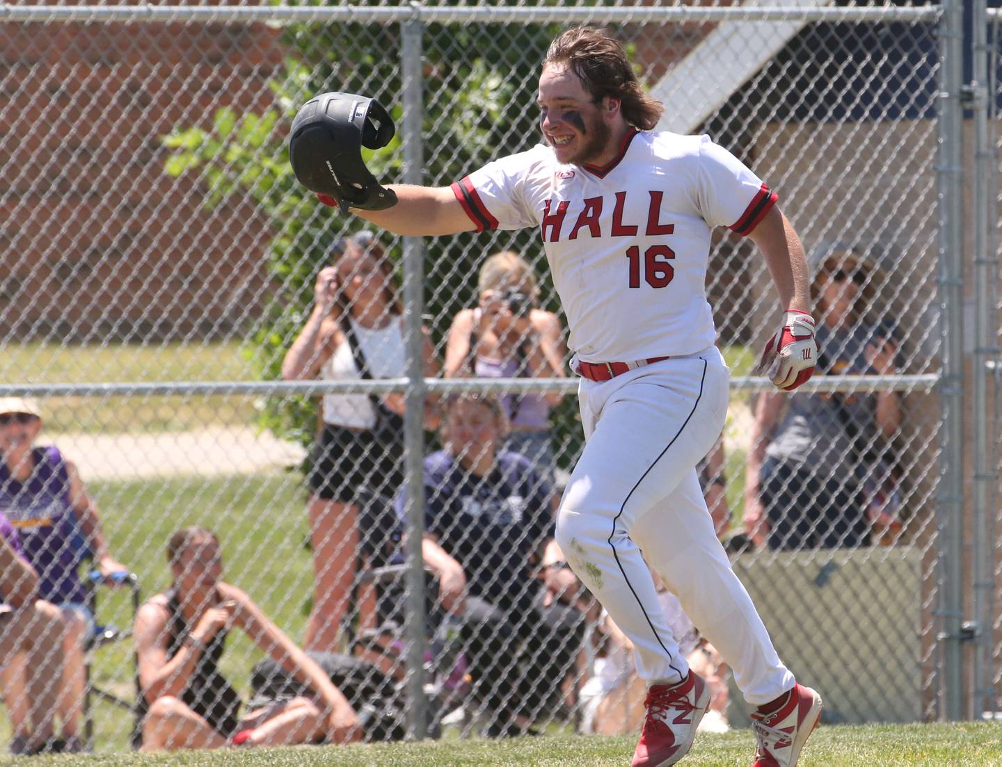 Hall's Joel Koch runs into home plate after hitting a home run against Sherrard during the Class 2A Sectional final game on Saturday, May 27, 2023 at Knoxville High School.