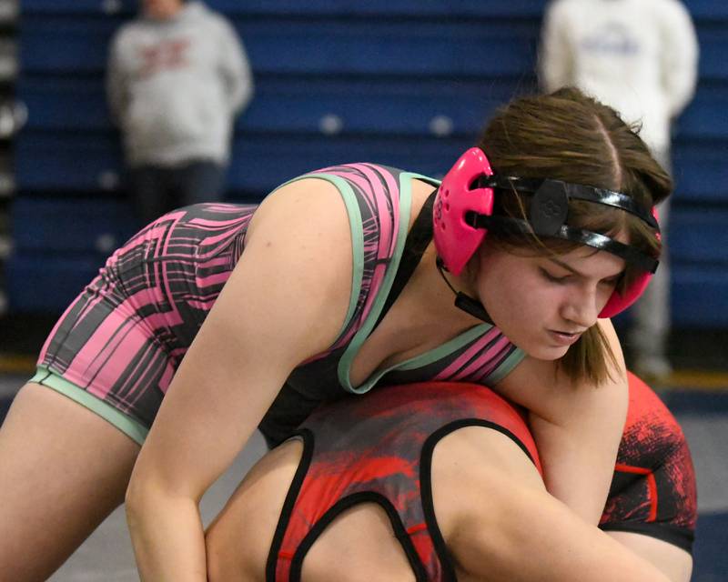 Ava Kok Woodstock Alyssa Galarza, top, wrestles East aurora in the 140 weight-class on Saturday Jan 4, 2025, during the Aaron Dundley invite held at Oswego East High School.