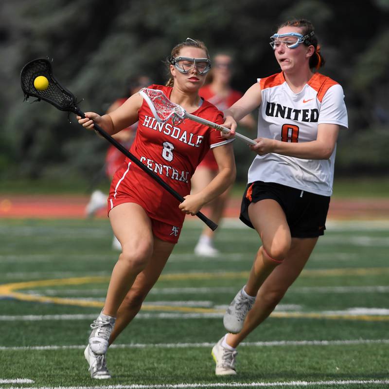 Crystal Lake Central Coop’s Izzy Jackson, right, tries to take the ball from Hinsdale Central’s Addison Linn during the third-place game of the girls lacrosse state finals at Hinsdale Central High School on Saturday, June 7, 2025.