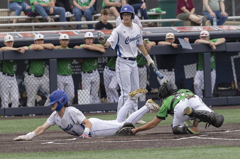 Newman’s Garret Matznick steals home against Eureka Saturday, June 7, 2025, during the Class 2A state baseball third place game at Illinois Field in Champaign.