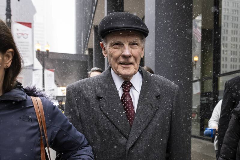 Flanked by supporters and holding hands with his daughter Nicole, Illinois' former House Speaker Michael Madigan walks out of the Dirksen Federal Courthouse in Chicago, Wednesday, Feb. 12, 2025. (Ashlee Rezin/Chicago Sun-Times via AP)