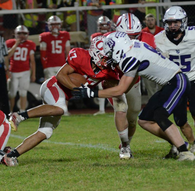 Dixon's Bene Baratta (8) tackles Oregon's Gage Blake (17) on Friday, Sept. 26, 2025 at Landers-Loomis Field in Oregon.