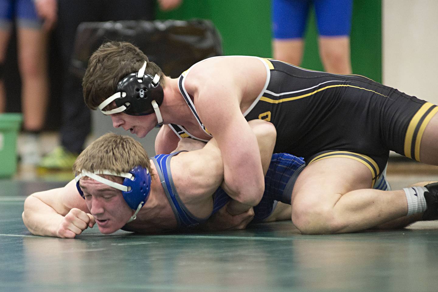 Harvard's Bailey Livdahl works on pinning Newman Central Catholic's Thomas Powers at 160 pounds during the Class 1A Rock Falls Dual Team Sectional on Feb. 22, 2022.