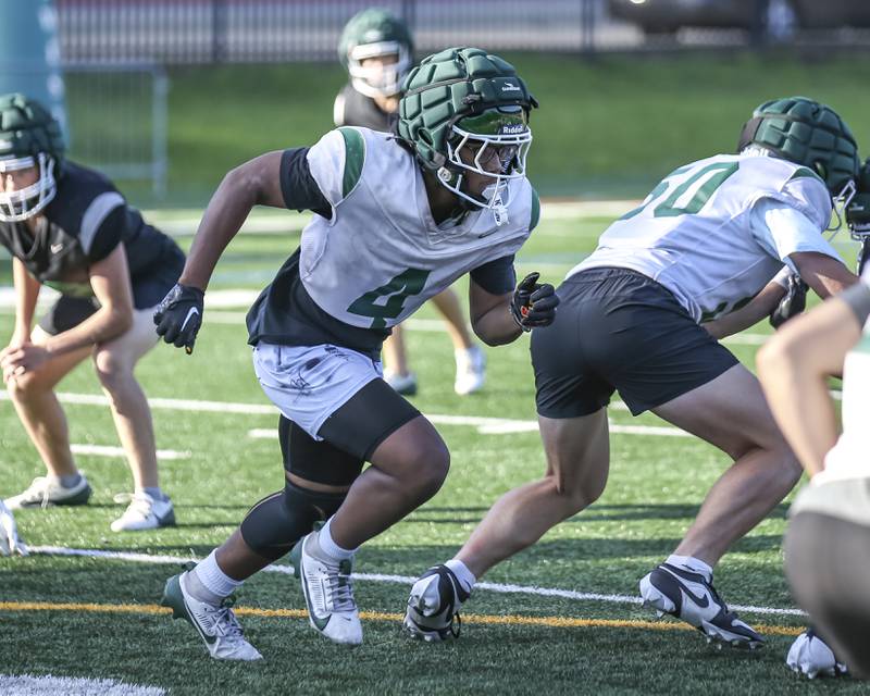 Jamarcus Kelly goes into motion before the snap at Glenbard West football practice, Wednesday, Aug 21, 2025  in Glen Ellyn.