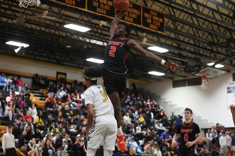 Plainfield East’s Ehi Ognomo draws the foul going for the dunk against Joliet West on Friday, Dec. 8th, 2023 in Joliet.