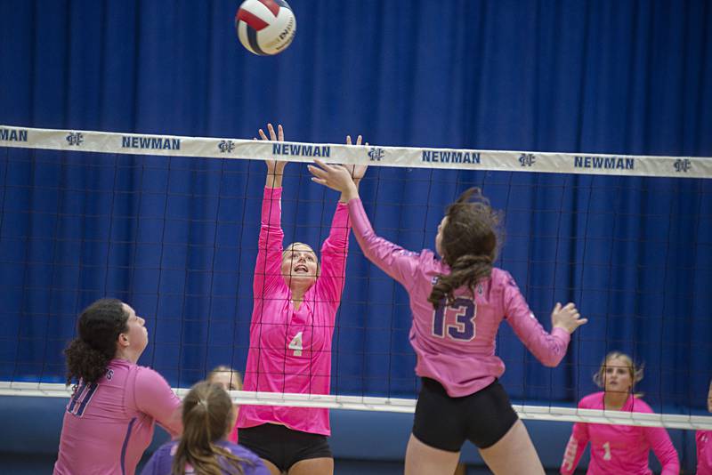 Newman’s Katie Grennan goes up to block a shot against Mendota, Tuesday, Oct. 4, 2022.