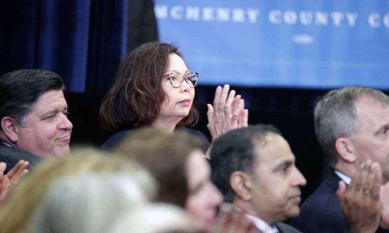 U.S. Sen. Tammy Duckworth and Illinois Gov. JB Pritzker, both Democrats, listen to President Joe Biden, speak at McHenry County College Wednesday, July 7, 2021 in Crystal Lake.
