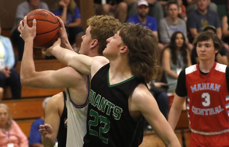 Johnsburg's Ben Person battles with Alden-Hebron’s Nolan Vanderstappen during the boy’s game of McHenry County Area All-Star Basketball Extravaganza on Sunday, April 14, 2024, at Alden-Hebron’s Tigard Gymnasium in Hebron.