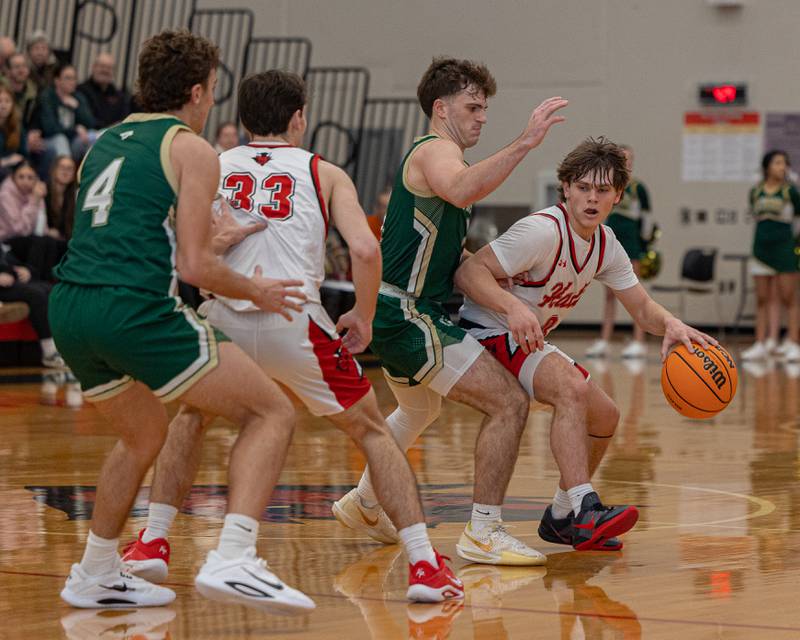 Hall's Greyson Bickett (0) dribbles ball around St. Bede's Gus Burr (2) as Braden Curran (33) of Hall sets a screen for Bickett on Saturday, January 31, 2026 at Hall High School in Spring Valley.