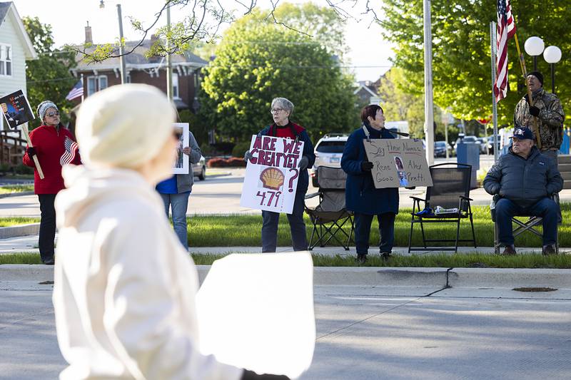 A supporter leans out of a car Friday, May 1, 2026, during a May Day protest at Central Park in Sterling. Indivisible Sauk Valley organized the gathering to continue to voice their displeasure with the Trump Administration.