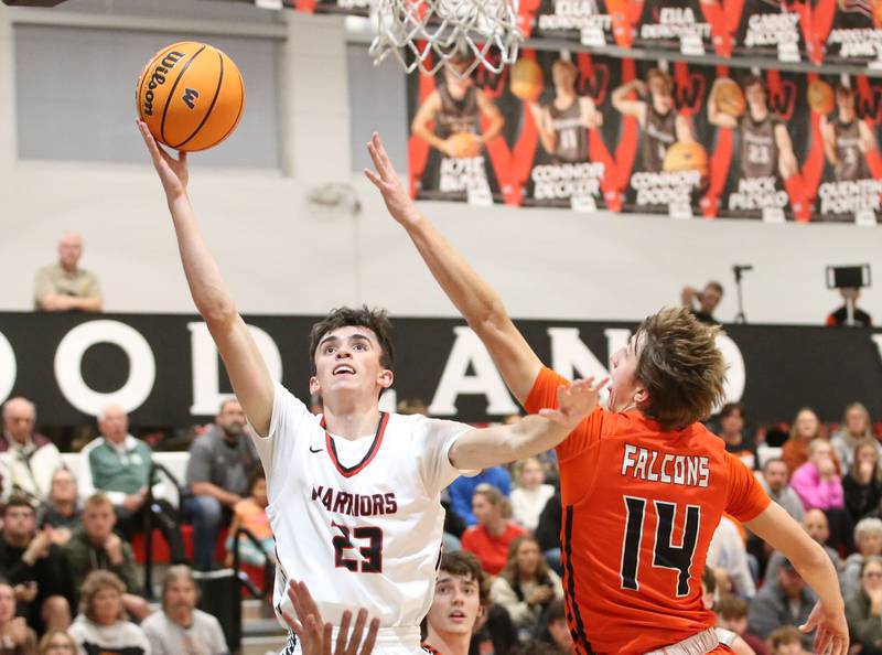 Woodland's Nick Plesko eyes the hoop as Flanagan-Cornell's Seth Jones defends during the Route 17 Classic Tournament on Wednesday, Nov. 27, 2024 at Woodland High School.
