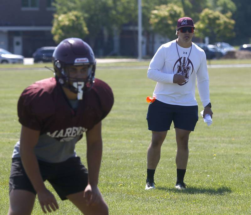 Marengo Head Coach Paul Forsythe watches a players run a drill during summer football practice Monday, June 27, 2022, at Marengo Community High School in Marengo.