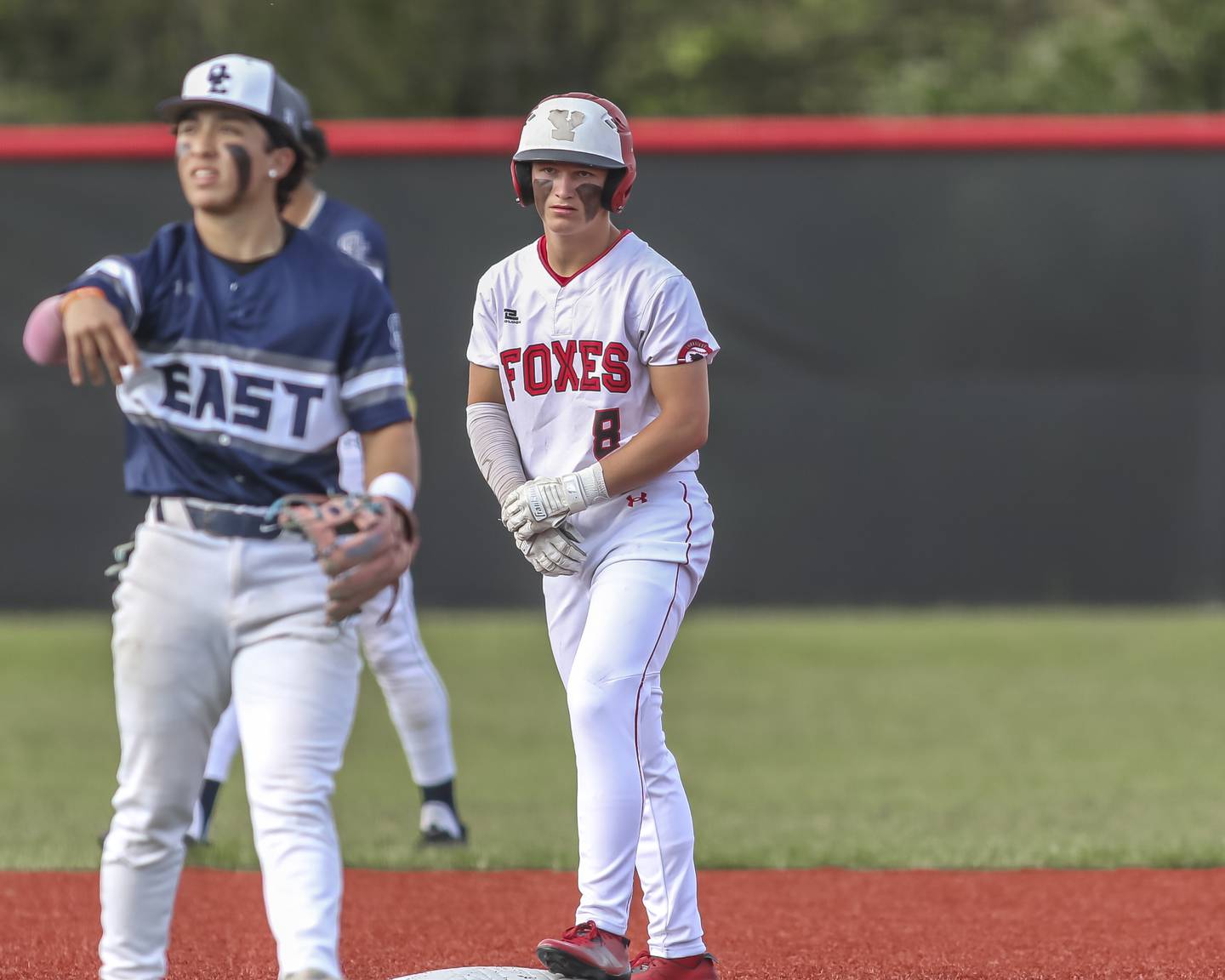 Yorkville's Justin Giese (8) stands on second after hitting a double during baseball game between Oswego East at Yorkville. Monday, May 12, 2025 in Yorkville.