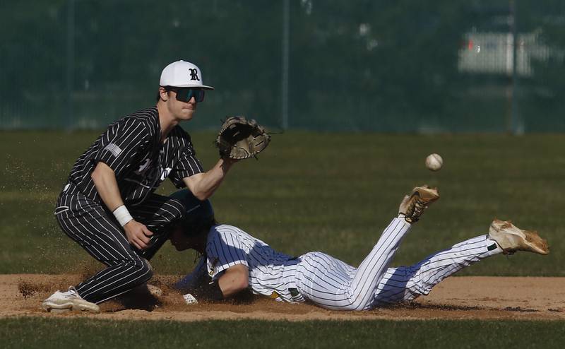 Crystal Lake South’s Dayton Murphy slides into second base in front of the throw to Prairie Ridge's Brennan Coyle during a Fox Valley Conference baseball game on Monday, April 8, 2024, at Crystal Lake South High School.