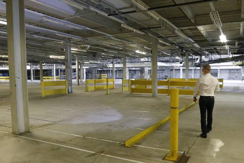 Sean Stofer, COO of Green Data Center Real Estate, Inc., shows a manufacturing and packing area inside the property at the former Motorola headquarters on Thursday, June 10, 2021 in Harvard.