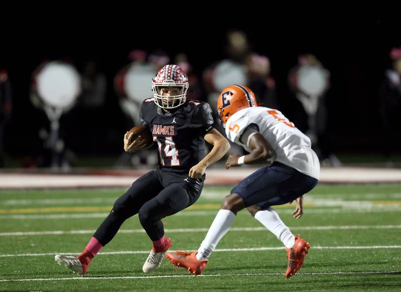 Maine South's Constantine Coines (14) moves around Evanston's (5) Friday October 20, 2023 in Park Ridge.