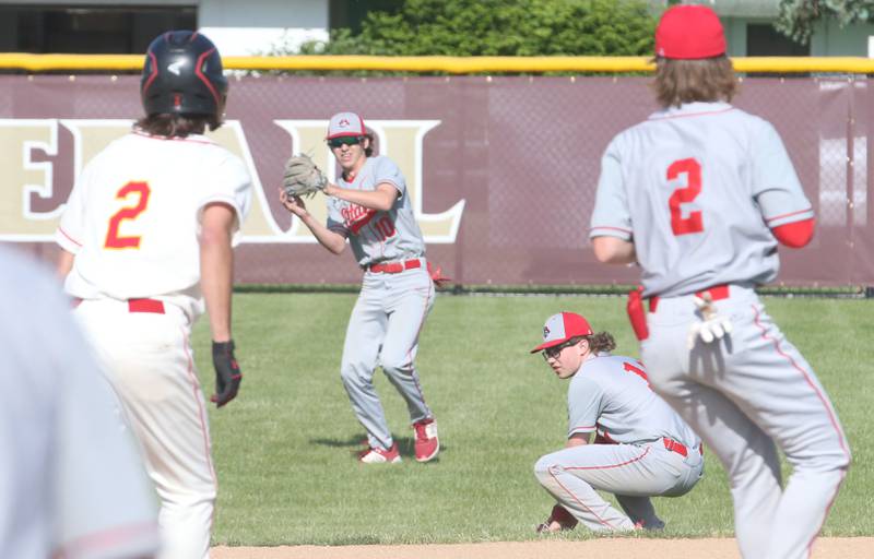 Ottawa's Dillan Quatrano catches a fly ball as Rock Island's Jaron Morris (left) tags up to second base during the Class 3A Regional semifinal game on Thursday, May 25, 2023 at Morris High School.