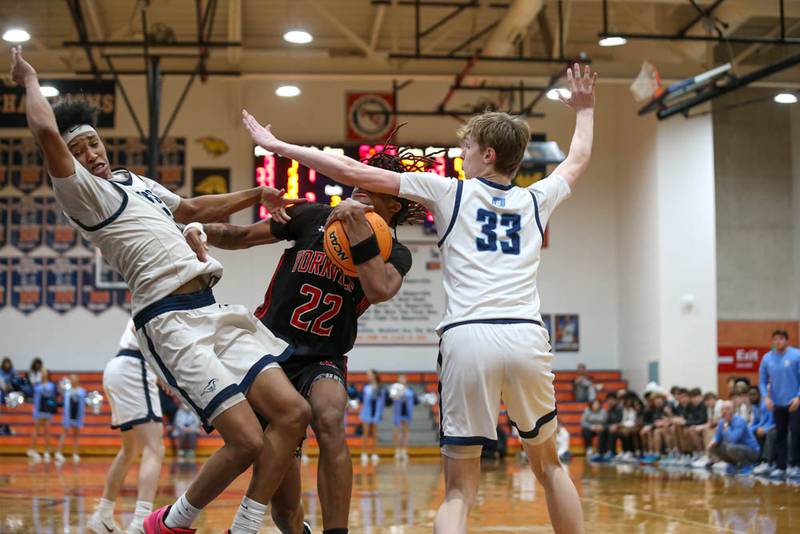 Yorkville's Braydon Porter (22) gets called for a charge on a drive to the basket during their Class 4A Naperville North Regional final basketball game between Yorkville at Downers Grove South, Feb 27, 2026 in Naperville.