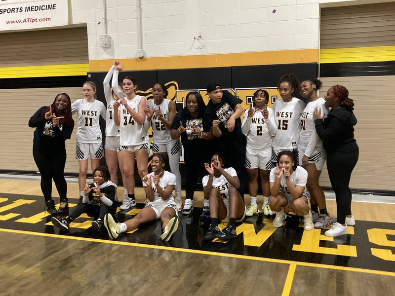 The Joliet West girls basketball team after beating Romeoville Thursday.