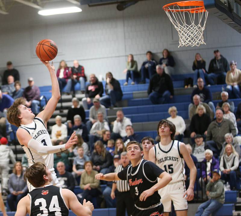 Fieldcrest's Connor Reichman floats in the lane to score against Fisher on Tuesday, Jan. 2, 2024, at Fieldcrest High School.