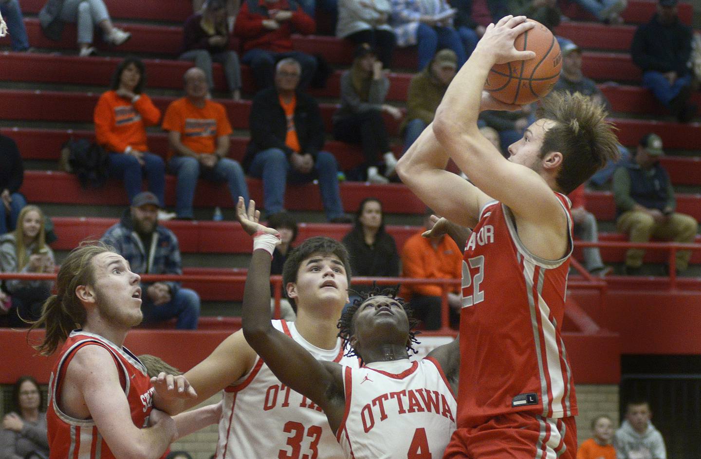 Streator’s Christian Benning shoots over Ottawa’s Keevon Peterson, Cooper Knoll and team mate Quinn Baker  in the 4th period Saturday during the Dean Riley Shootin’ The Rock Thanksgiving Tournament at Ottawa.
