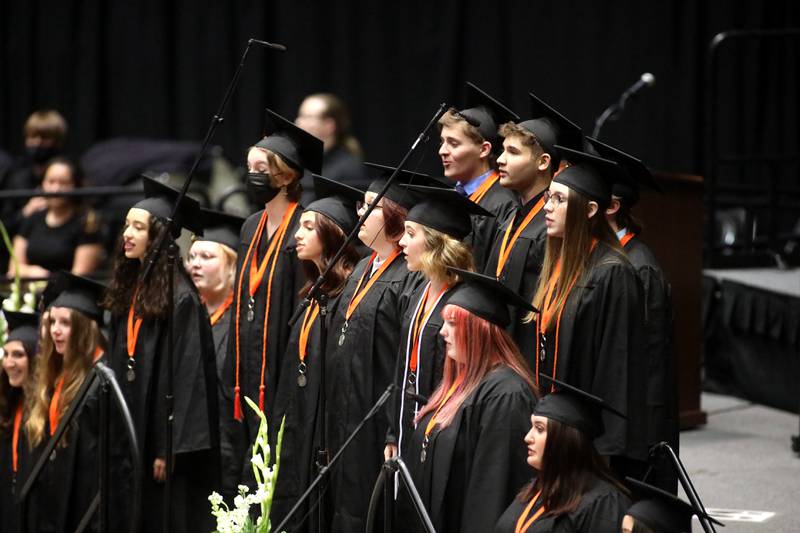 Senior members of the St. Charles East High school choir perform during the school’s commencement ceremony at the Northern Illinois University Convocation Center in DeKalb on Monday, May 23, 2022.