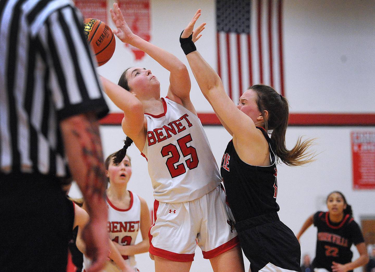 Benet's Samantha Trimberger (25) shoots a layup against Yorkville defender Katlyn Schraeder during the Girls' Class 4A Regional Final at Yorkville High School on Thursday, Feb. 16, 2023.