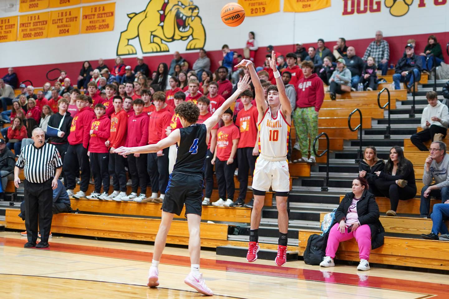 Batavia’s Joe Reid (10) shots a three pointer over Burlington Central's Ryan Carpenter (4) during a Batavia Night of Hoops Basketball game at Batavia High School on Saturday, Jan. 25, 2025.