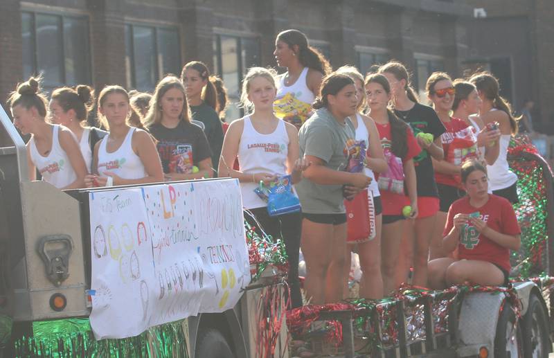 Members of the L-P girls tennis team ride on a float during the L-P homecoming parade on Thursday, Oct. 2, 2025 downtown Peru.