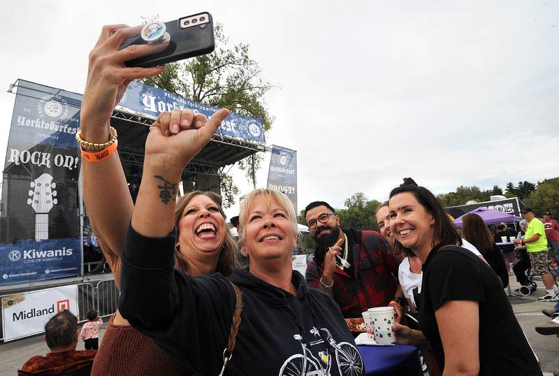 Dawn Niles and sisters Cathy Diaz and Sabrina Schaller shoot a selfie during Yorktoberfest, Saturday, Sept. 28, 2024, in Riverfront Park in Yorkville.