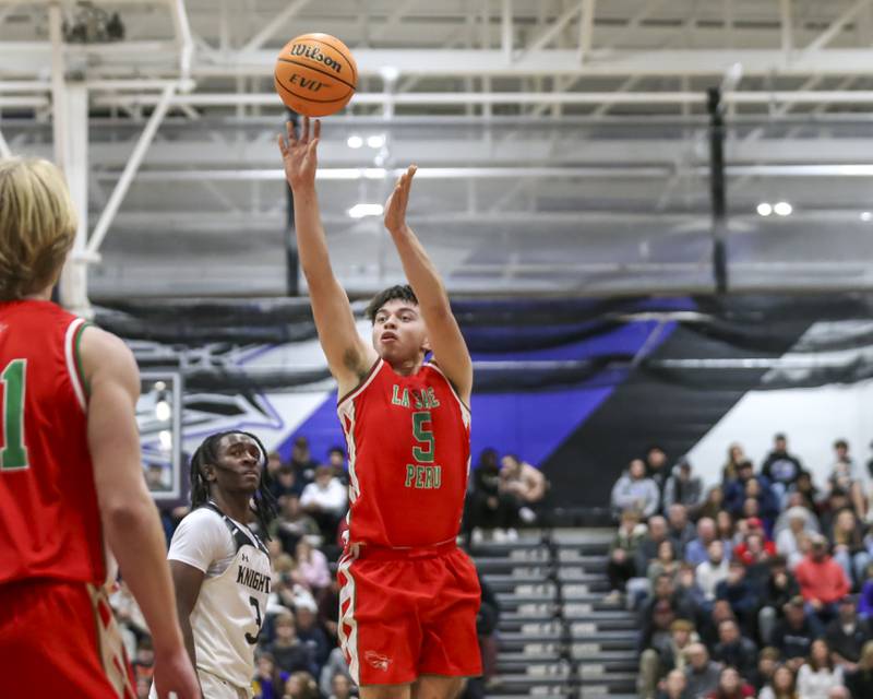 LaSalle Peru's Erick Sotelo (5) shoots a jumper during their Plano Christmas Classic semi-final basketball game between Kaneland at LaSalle Peru Monday, Dec 29, 2025 in Plano.