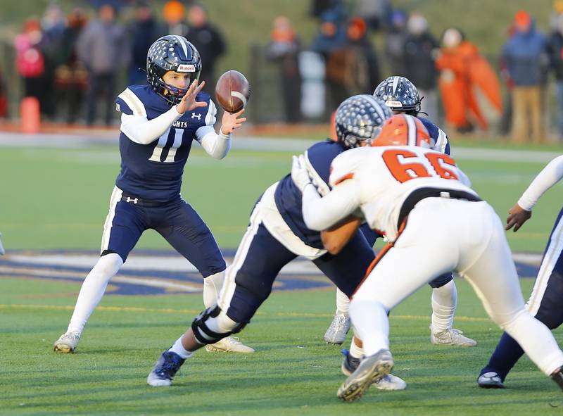 IC Catholic's Dennis Mandala (11) takes a snap during a Class 3A varsity football semi-final playoff game between Byron High School and IC Catholic Prep on Saturday, Nov. 19, 2022 in Elmhurst, IL.