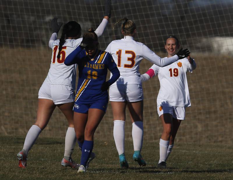 Richmond-Burton’s Brianna Maldonado (left) and Jordon Otto celebrate with Layne Frericks after Frericks scored a goal during a Kishwaukee River Conference soccer game against Johnsburg on Wednesday, March 20, 2024, at Johnsburg High School.