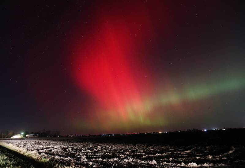 The Aurora Borealis (Northern Lights) dazzles over a barn near the intersection of Illinois Route 251 and 34th Road between Peru and Mendota on Tuesday, Nov. 11, 2025. Two coronal mass ejections (CMEs) created sparking geomagnetic storm conditions, according to the National Oceanic and Atmospheric Administration (NOAA). Space weather forecasters anticipate that geomagnetic activity may intensify to strong (G3) conditions overnight and could be around again tomorrow night.