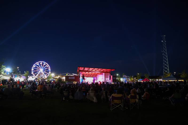 Attendees listen to live music during the 50th Bourbonnais Friendship Festival on Friday, June 27, 2025.