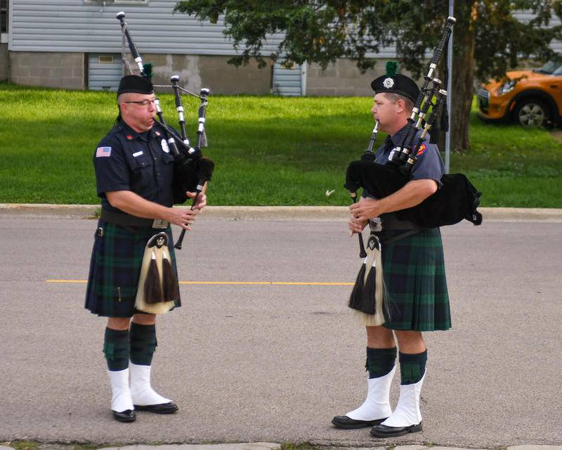 Bagpipers Tom Conley (left) and Eric Blanken play "Amazing Grace" during a 9/11 remembrance ceremony at DeKalb Fire Station No. 1.