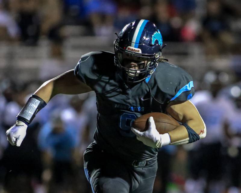 Downers Grove South's Mack O'Halloran (9) takes off enroute to the endzone during varsity football game between Willowbrook at Downers Grove South.  Sept 16, 2022