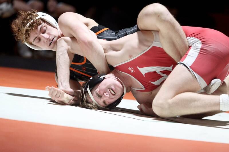 Crystal Lake Central’s Alessio Pezzella, left, battles Huntley’s Shane McGuine in a 150-pound bout in varsity wrestling at Crystal Lake Friday. Pezzella won the match.