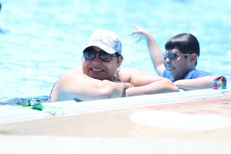 Patricia Ferrera keeps cool with her son Christopher at the Ottawa Street Pool in Plainfield. Tuesday, June 14, 2022 in Plainfield.