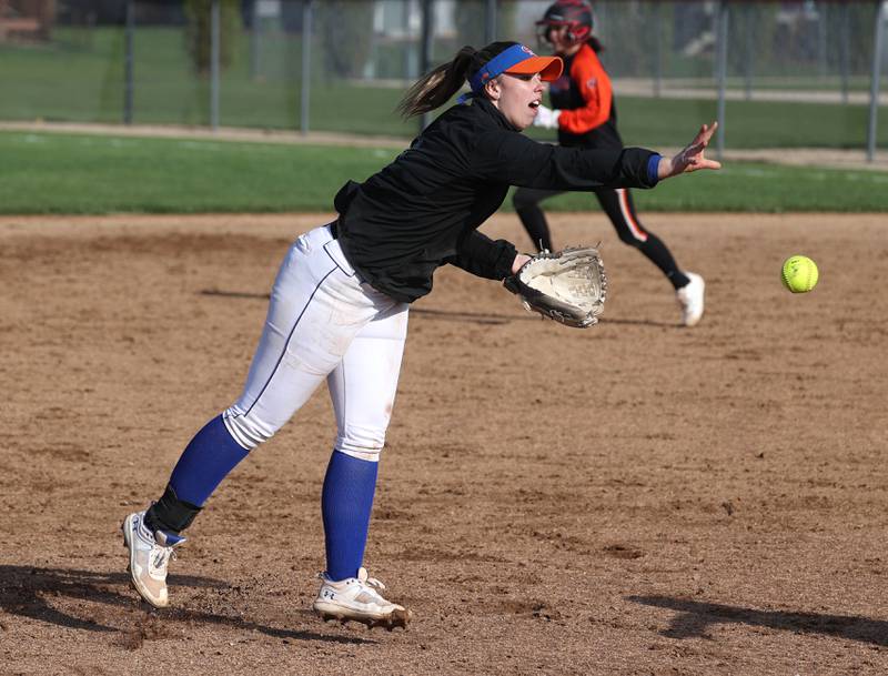 Genoa-Kingston’s Elizabeth Davis flips the ball to third for a force out during their game against Winnebago Monday, April 21, 2025, at Genoa-Kingston High School.
