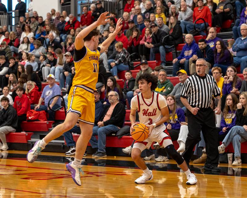 Noah Plym (3) of Hall fakes shot making Aden Tillman (11) of Mendota jump on Saturday, December 20, 2025 at Hall High School in Spring Valley.