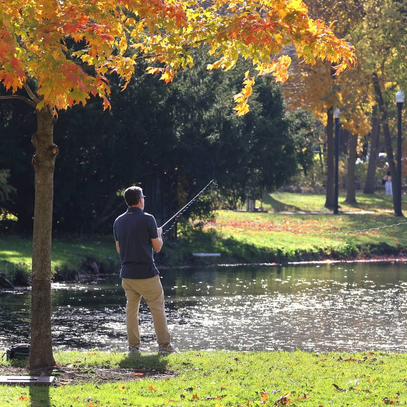 Matt O’Connell, a masters student at Northern Illinois University from Barrington, does some fishing Tuesday, Oct. 24, 2023, in the lagoon at NIU in DeKalb.