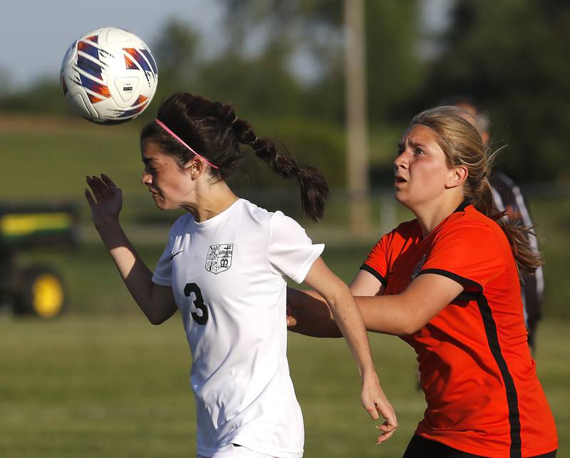 Boylan's Joscelyn Posada heads the ball away from Crystal Lake Central's Brooklyn Carlson during the IHSA Class 2A Burlington Central Girls Soccer Sectional final match Friday, May 26, 2023, at Burlington Central High School.