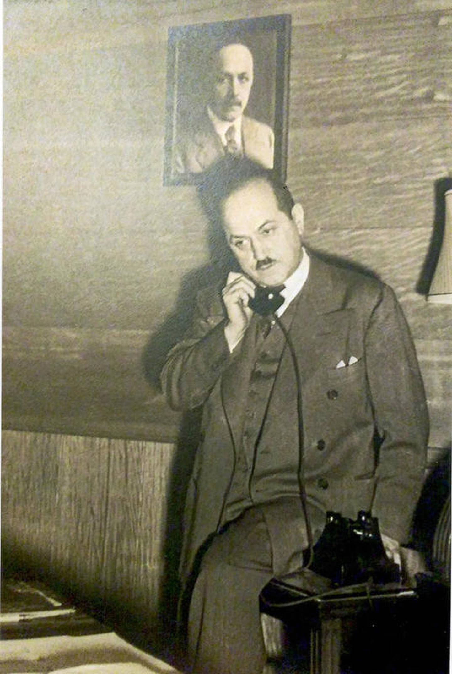 Albert Felman, owner/operator of The Boston Store in Joliet, is seen in his office. Behind, him is a photo of his father, Maurice Felman, founder of the store. Albert grew up on Western Avenue with his mother Bertha and his father and then raised his family in that home.
